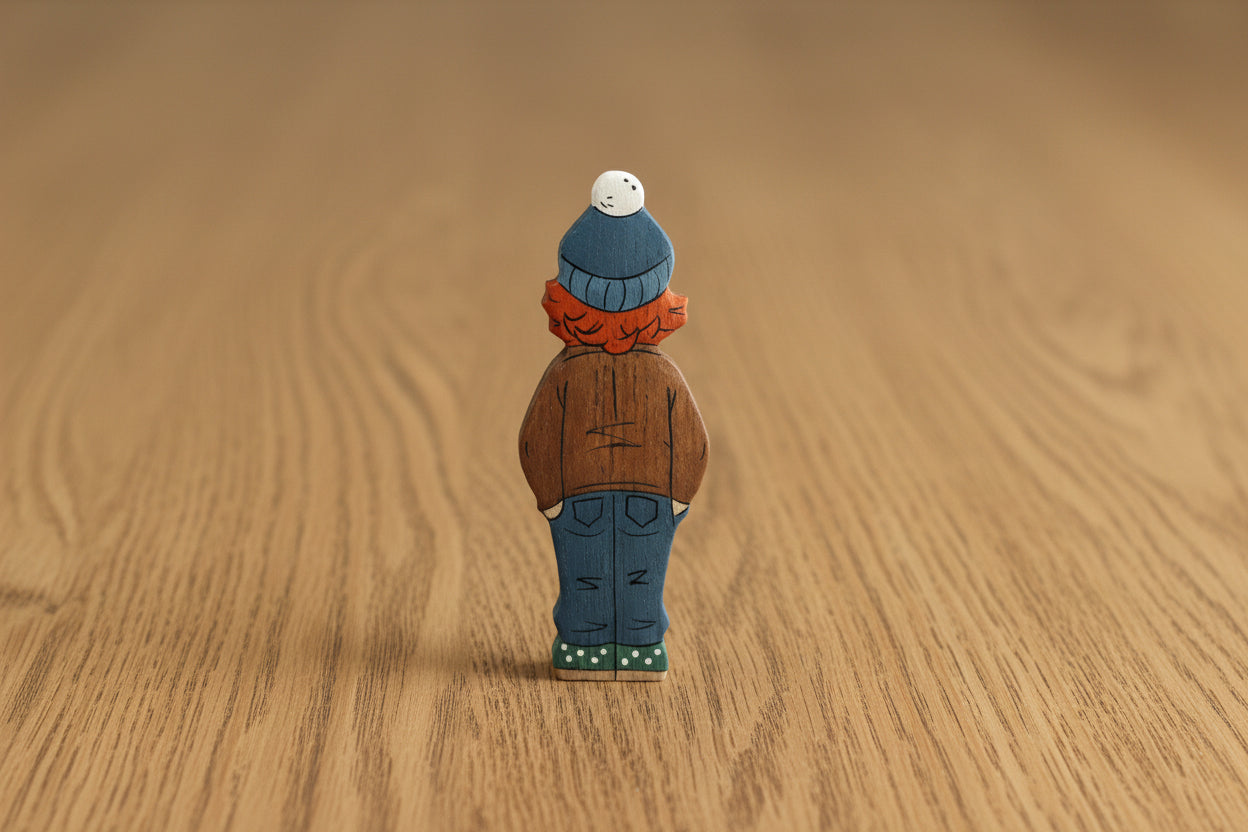 Wooden Girl Figurine in Brown Coat – Handcrafted Winter Toy for Kids